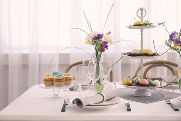 Beautiful Easter table setting in light room