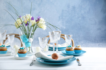 Beautiful Easter table setting with blue plate