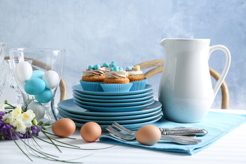 Beautiful Easter table setting with blue plate
