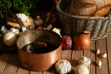Pot of mushroom soup and ingredients