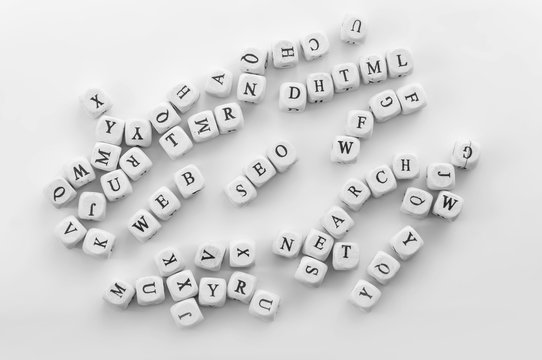 Few Internet science words as SEO, DHTML, WEB, SEARCH, NET spelled by dice with english letters