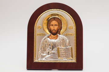 Fototapeta premium Church icon Silver icon of Jesus with gold inserts