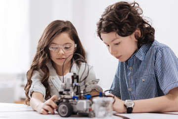 Friendly children using with modern technologies at school