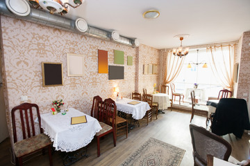 Tables and chairs in empty cafe