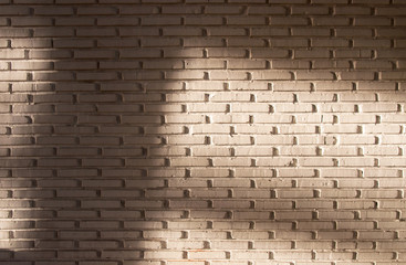 Brick wall background with shadow pattern