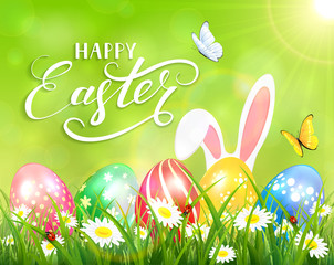 Happy Easter on green background with bunny and eggs