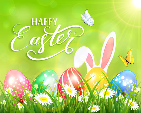 Happy Easter on green background with bunny and eggs