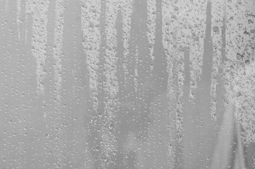 Wet glass texture with splash drops of water