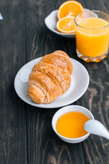 Healthy Breakfast croissant with fresh orange juice 