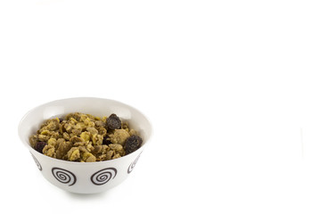 Bowl of muesli with dry fruits isolated on white background