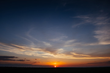 Naklejka na ściany i meble Sunset sunrise with clouds, light rays and other atmospheric e