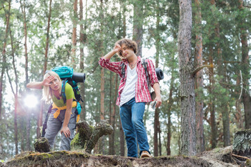 Tired hiking couple in forest