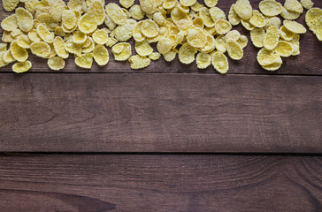 Corn flackes on wooden table
