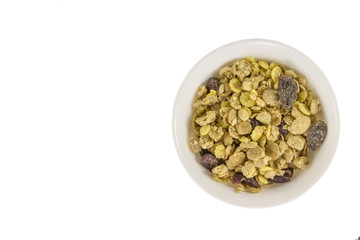 Top view . Bowl of muesli isolated on white background