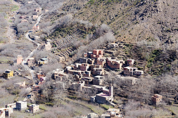 Obraz premium Modest traditional berber village with cubic houses in Atlas mountains, Morocco