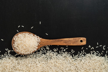 Wooden spoon with raw rice © Vladimir Borozenets