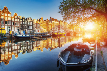 Amsterdam canal at sunset.  is the capital - obrazy, fototapety, plakaty