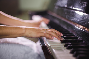 The bride plays the piano