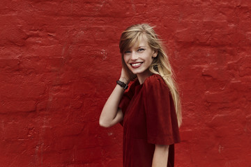 Portrait of stunning woman in red dress