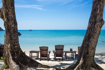 Beach chairs on beach with Blue sea , Blue sky