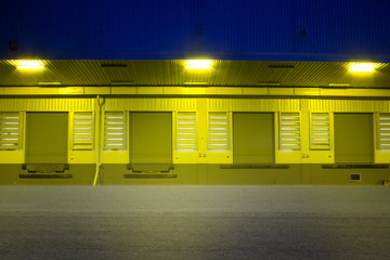 Night warehouse on road