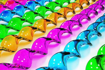 Obraz premium Glass spiral sticks different colors on white background