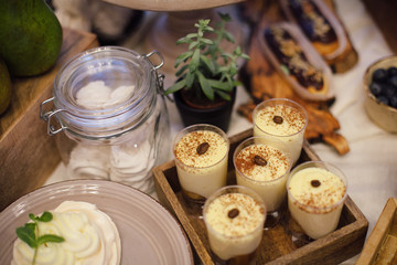 Sweet bar with Tiramisu  and Meringues on wooden tray in the area  of the wedding banquet