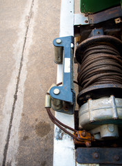 Old sling cable of electric winch in front of 4wd car