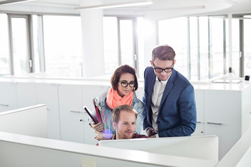 Business people working on computer in creative office