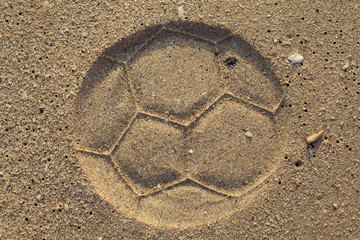 Soccer ball footprint on a sand with classical pentagon texture
