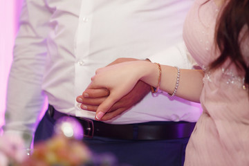 the groom holds the of the wife by a hand. Love concept, wedding day