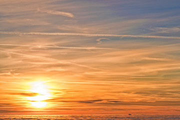 Amazing evening with sunset in mountains. Beautiful sunset within inversion