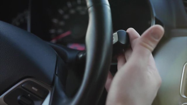 Close up shot of a man's hand running the glass clean with the help of a button