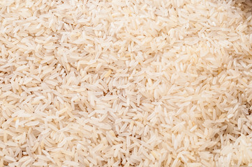 Top view to raw white Jasmine rice background