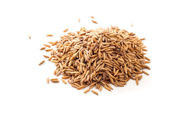 Heap of raw unpolished rice on white background