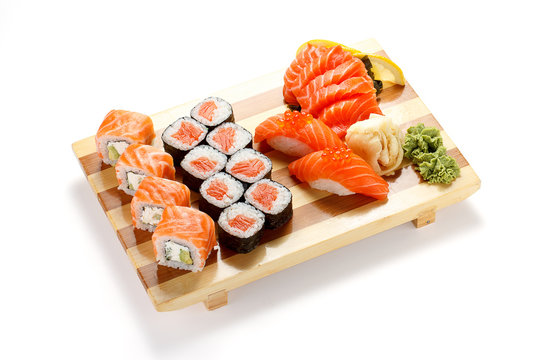 Japanese cuisine. Sushi and rolls set isolated on white background.
