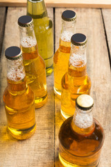 Beer bottles on a wooden table .