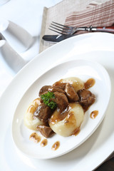 Silesian dumplings on white plate