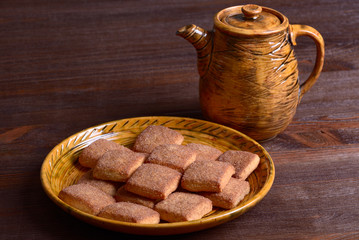 Cookies with cinnamon and teapot
