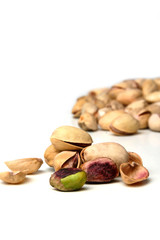 Studio shot  of pistachios on white background