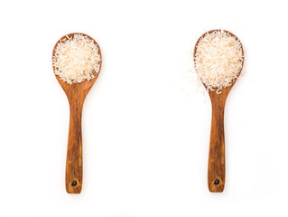 Wooden spoons with heap of Jasmine white raw rice