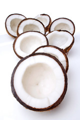 Studio shot of halved coconuts