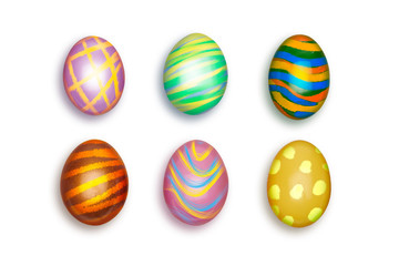 Looking down, vertical view of Small colorful decorated Easter eggs isolated on a white background.