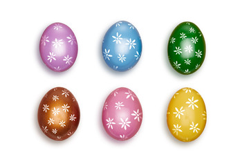 Looking down, vertical vew of Small colorful decorated Easter eggs isolated on a white background.