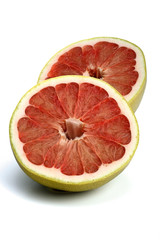 Halved grapefruit on white background