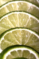 Lime slices on white background