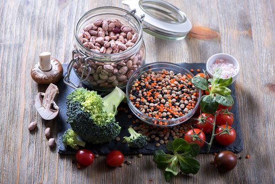 Cooking ingredients with lentils and beans in bowl, vegetarian and vegan food concept, healthy eating background