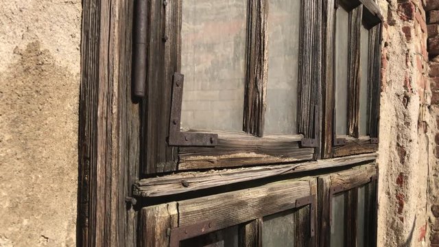 Abandoned house old weathered window details 4K 2160p 30fps UltraHD footage - Wood and glass broken with destructed building facade 3840X2160 UHD video 