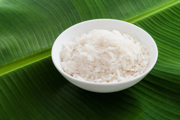 Plain Jasmine white rice in bowl on natural banana leaf