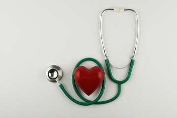 Stethoscope and heart on white background. Place for your text.